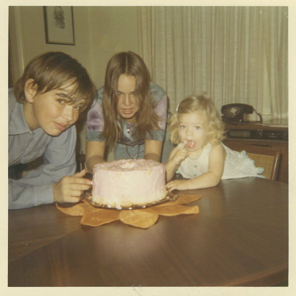 With my brother and sister and a birthday cake