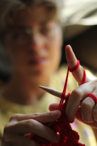 I start the six-foot red scarf. Photo by Derek Howard.