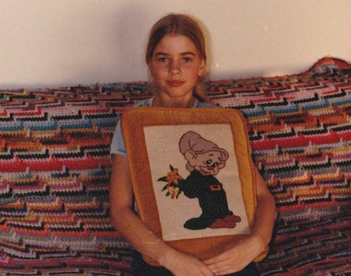 Me with my mom's needlepoint pillow